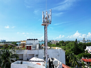 Telecommunication tower of 4G and 5G cellular. Base Station or Base Transceiver Station. Wireless Communication Antenna Transmitter. Telecommunication tower with antennas against blue sky.