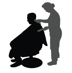Silhouette of a man in a hairdressing chair being groomed by a female hairdresser