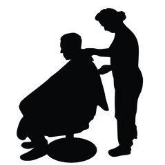 Silhouette of a man in a hairdressing chair being groomed by a female hairdresser