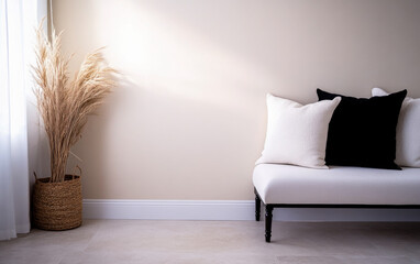 Modern living room with a minimalist white couch and decorative palm plant in soft natural light