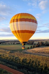 Obraz premium : Hot air balloon flight. Romantic date in the air. View of beautiful landscape with balloons from above. Sports competition on hot air balloons