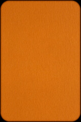 Fototapeta premium background for Halloween: close up of orange color textured cardboard shadowed at edges