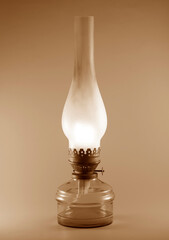 Old kerosene lamp in a glass bulb. Vintage color image.