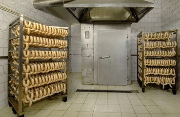 smokehouse in industrial production, industrial smoking chamber Raw sausagess on the rack