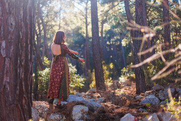 young and beautiful dancer practicing intently among natural landscapes. A young and beautiful girl...