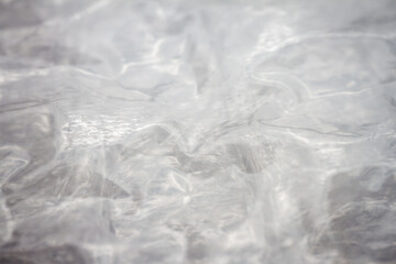 Extreme macro of plastic bubble wrap texture. Selective soft focus, shallow depth of field. Abstract dreamy background