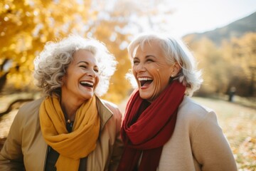 Fototapeta premium Senior women having coffee in a cafe and laughing