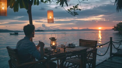 Fototapeta premium Man Dining Alone at a Table Overlooking a Sunset Ocean