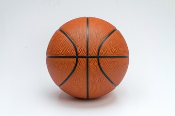 Fototapeta premium A classic orange basketball with black lines isolated on a white background.