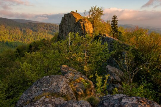 Colorful evening in the rocks, colored trees and sky, setting sun, sunset. Mountain dramatic sunset panorama in peak Buchlov, Vtacnik, Horna Nitra.