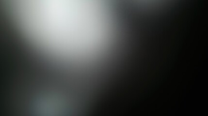 Fototapeta premium Minimalist black background with a soft gradient from dark gray to light black, designed with high resolution and subtle texture for enhanced visual impact. This background features a delicate, blurry