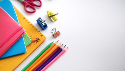 Colorful stationery on side position provides copy space for text. background concept isolated white