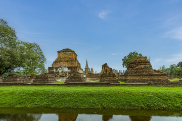 Ancient Buddha statue and ruin of temple of Wat mahathat temple in Sukhothai Historical Park, which also one of UNESCO Heritage Site