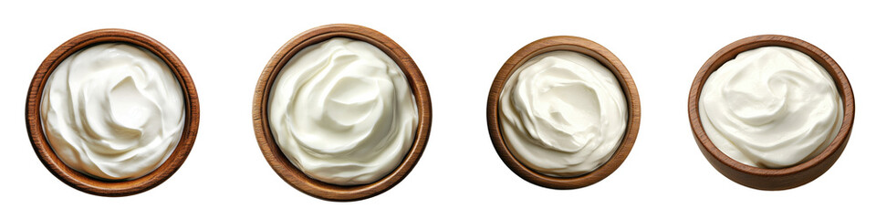 Sour cream or yogurt in a rustic wooden bowl, elegantly presented against a clean white background, inviting culinary creativity and freshness.