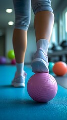 Naklejka premium Leg and Foot on Exercise Ball in Fitness Studio