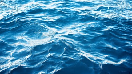 Obraz premium Water texture: A close-up of water surface texture, showing ripples, waves, or patterns created by wind or movement.