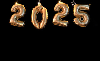 Happy new year 2025 concept, golden  foil balloons on black  background and space for  text 