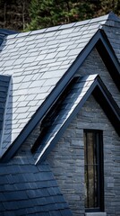 Dark slate roof covering modern house with visible window