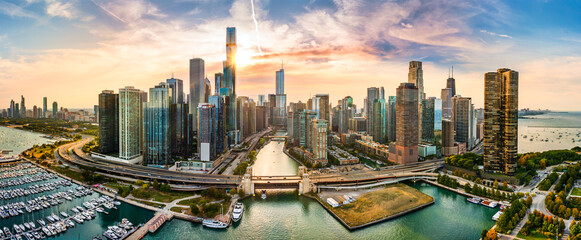 Aerial panorama of Chicago, Illinois skyline at sunset. Chicago is the most populous city in the U.S. state of Illinois and in the Midwestern United States. © mandritoiu