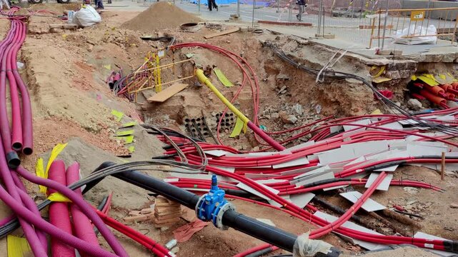 Underground cabling works.Smooth camera movement: Panning Right. 
View of the installation of new fibre optic networks and other services in the city of Barcelona.