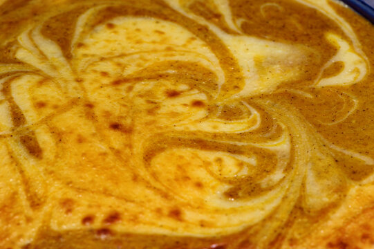Swirled patterns in cake batter, closeup