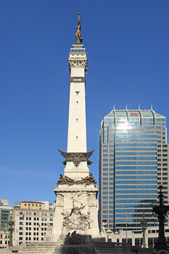 Famous Indiana State Soldiers and Sailors Monument, tall neoclassical monument on Monument Circle, in center of downtown Indianapolis, Indiana, on sunny summer day