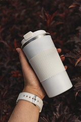 hand holding a cup autum