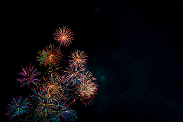 Colorful fireworks on a black background by AI generative