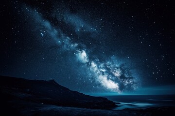 The night sky is filled with stars and a long, thin streak of light