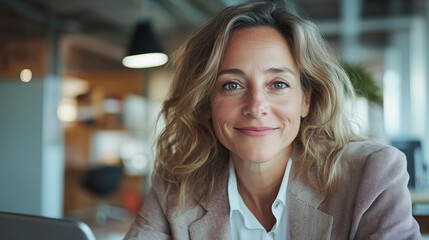 Confident businesswoman smiling in modern office setting