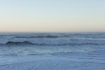Beach and sea background, view of the Atlantic ocean, from a city in Europe.