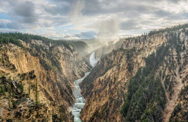 Yellowstone National Park sunset at Artist Point Overlook with view of Lower Falls at Grand Canyon of the Yellowstone River