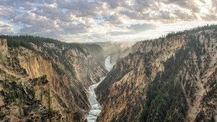 Yellowstone National Park sunset at Artist Point Overlook with view of Lower Falls at Grand Canyon of the Yellowstone River 