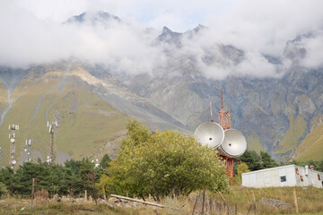 Telecommunications satellite dish radio telescope in mountains. Earth based astronomical...