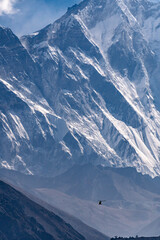 Helicopter flying among majestic Himalayan peaks, Nepal.