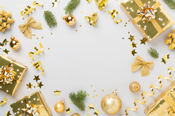 Christmas decor, gift boxes and confetti on color background, top view. Copy space for design