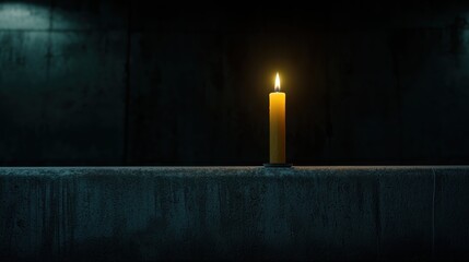 Candle is lit in a dark room. The candle is the only source of light in the room