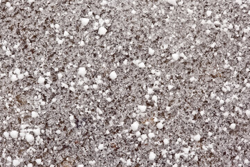 abstract closeup pattern of snow grains covering the ground
