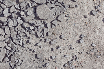 texture of crushed concrete or asphalt, graphic contrast pattern in bright sunlight