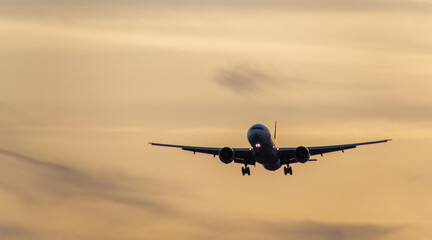 Airplane in the sunrise