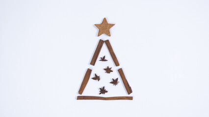 Christmas tree made from cinnamon sticks and star anise. Merry Christmas and Happy New Year concept.