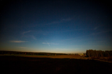 Night sky landscape and Tsuchinshan-Atlas comet in 2024. Starry sunset sky.