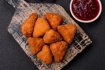Brie cheese or camembert fries in breading, fast food, takeaway
