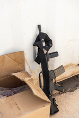 An American rifle is leaning against the wall in a soldiers' mess hall...