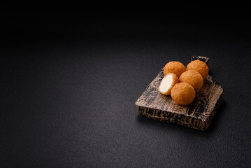 French fries balls with breaded brie or camembert cheese with sweet berry sauce