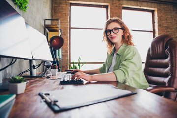 Photo of sweet charming lady assistant wear shirt eyeglasses writing messages modern device indoors...