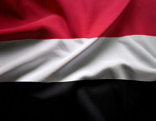 Obraz premium Republic of Yemen flag waving in the wind. Close up of Republic of Yemen banner blowing, soft and smooth silk.
