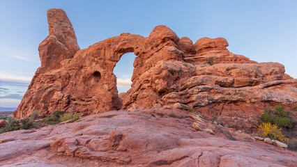Fototapeta premium Turret Arch is a large rock formation with a hole in the middle