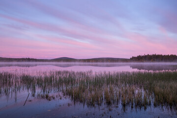 Autumnal lake scenery in Sweden during sunrise