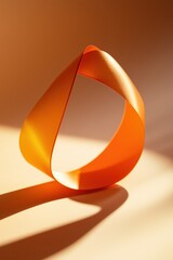 A piece of orange ribbon is folded into a triangle